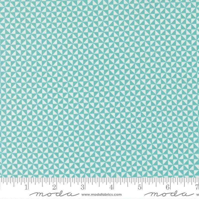 Image of Delightfully Yours Pinwheel Poolside quilting cotton fabric by Sherri & Chelsi for Moda Fabrics. Features triangles on a blue background. Cute Little Fabric Shop