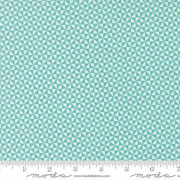 Image of Delightfully Yours Pinwheel Poolside quilting cotton fabric by Sherri & Chelsi for Moda Fabrics. Features triangles on a blue background. Cute Little Fabric Shop