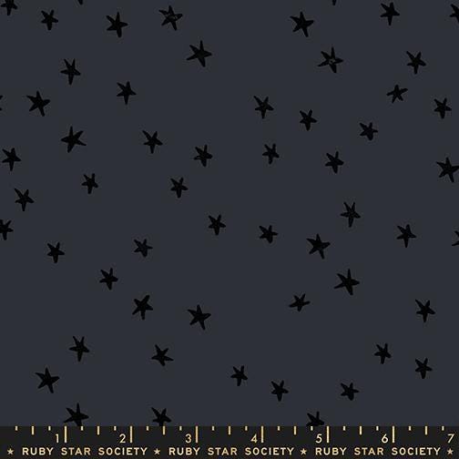 Image of the Starry New Blender Stars Charcoal quilting cotton fabric by Ruby Star Society for Moda Fabrics. Features small stars on a black background. Cute Little Fabric Shop