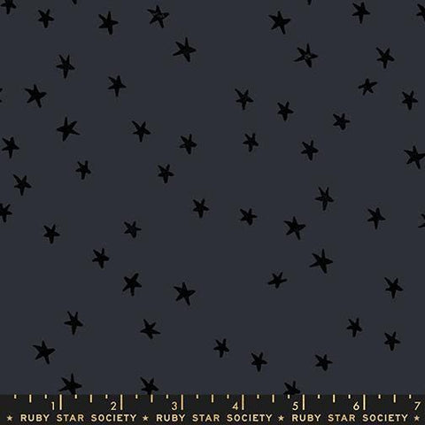 Image of the Starry New Blender Stars Charcoal quilting cotton fabric by Ruby Star Society for Moda Fabrics. Features small stars on a black background. Cute Little Fabric Shop