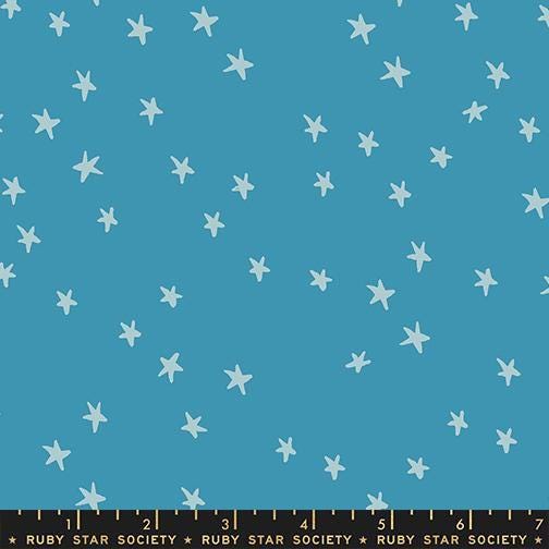 Image of the Starry New Blender Stars Vintage Blue quilting cotton fabric by Ruby Star Society for Moda Fabrics. Features small stars on a blue background. Cute Little Fabric Shop
