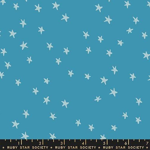 Image of the Starry New Blender Stars Vintage Blue quilting cotton fabric by Ruby Star Society for Moda Fabrics. Features small stars on a blue background. Cute Little Fabric Shop