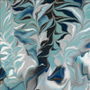 Image of the Virtuoso Fluid Fern Turquoise quilting cotton fabric by Ocllo Mason for QT Fabrics. Features swirled blue, green, and gray paint. Cute Little Fabric Shop