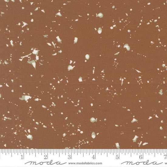 Image of the For My Boys Oliver Splatter Coco quilting cotton fabric by Sewn By Amy Schelle for Moda Fabrics. Features splatters on a brown background. Cute Little Fabric Shop