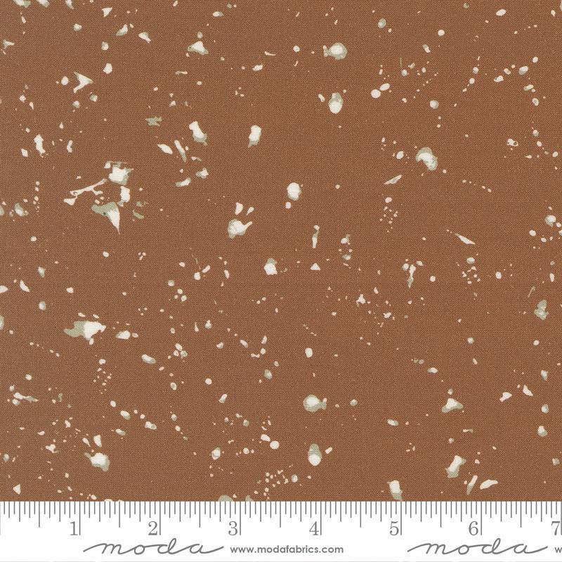 Image of the For My Boys Oliver Splatter Coco quilting cotton fabric by Sewn By Amy Schelle for Moda Fabrics. Features splatters on a brown background. Cute Little Fabric Shop