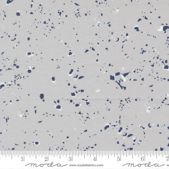 Image of the For My Boys Henry Splatter Silver quilting cotton fabric by Amy Schelle for Moda Fabrics. Features paint splatter on a gray background. Cute Little Fabric Shop.