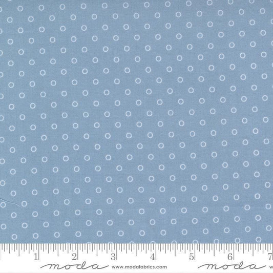 Image of the Nantucket Summer Dots Light Blue quilting cotton fabric by Camille Roskelley for Moda Fabrics. Features circles on a blue background. Cute Little Fabric Shop