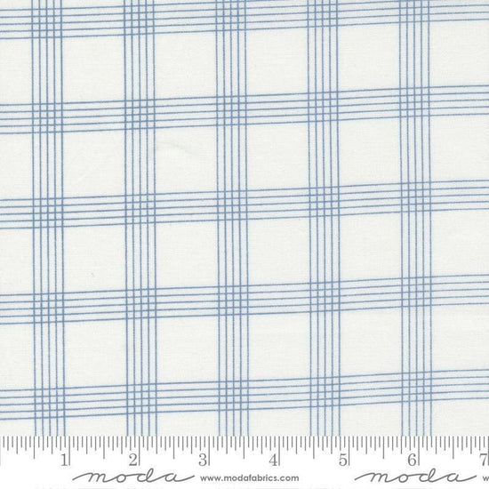 Image of the Nantucket Summer Checks Cream Blue quilting cotton fabric by Camille Roskelley for Moda Fabrics. Features plaid on a blue background. Cute Little Fabric Shop