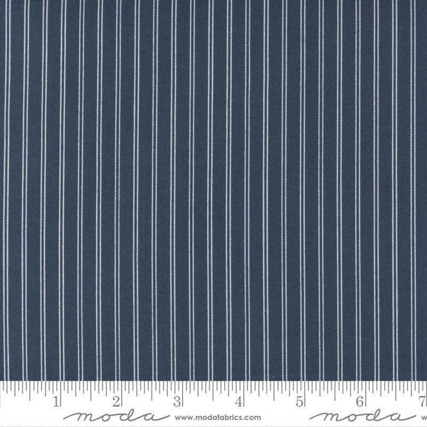 Image of the Nantucket Summer Stripes Navy quilting cotton fabric by Camille Roskelley for Moda Fabrics. Features stripes on a blue background. Cute Little Fabric Shop