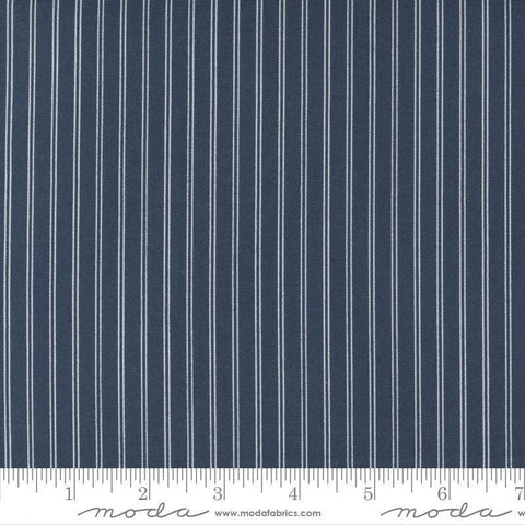 Image of the Nantucket Summer Stripes Navy quilting cotton fabric by Camille Roskelley for Moda Fabrics. Features stripes on a blue background. Cute Little Fabric Shop