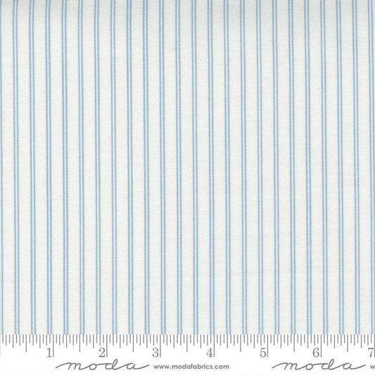 Image of the Nantucket Summer Stripes Cream Blue quilting cotton fabric by Camille Roskelley for Moda Fabrics. Features stripes on a blue background. Cute Little Fabric Shop