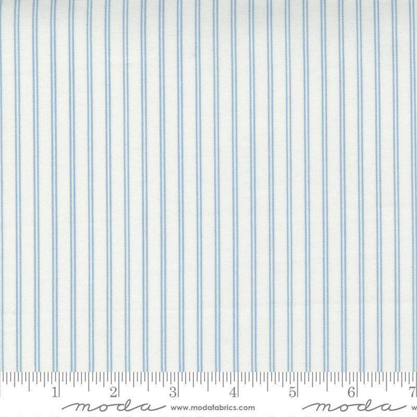 Image of the Nantucket Summer Stripes Cream Blue quilting cotton fabric by Camille Roskelley for Moda Fabrics. Features stripes on a blue background. Cute Little Fabric Shop