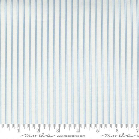 Image of the Nantucket Summer Stripes Cream Blue quilting cotton fabric by Camille Roskelley for Moda Fabrics. Features stripes on a blue background. Cute Little Fabric Shop