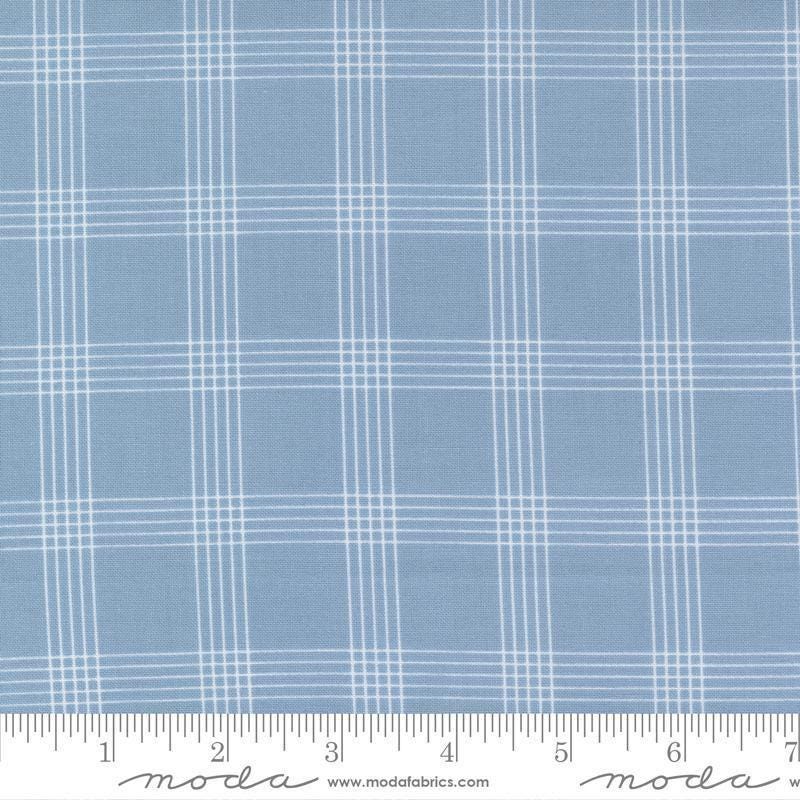 Image of the Nantucket Summer Checks Light Blue quilting cotton fabric by Camille Roskelley for Moda Fabrics. Features plaid on a blue background. Cute Little Fabric Shop