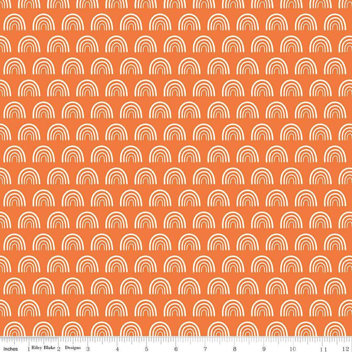 Image of the Two by Two Chasing Rainbows Orange quilting cotton fabric by Cayla Naylor for Riley Blake Designs. Features rainbows on a orange background. Cute Little Fabric Shop