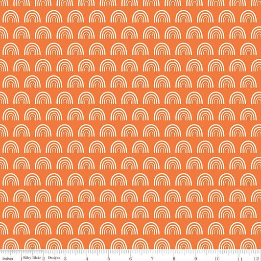 Image of the Two by Two Chasing Rainbows Orange quilting cotton fabric by Cayla Naylor for Riley Blake Designs. Features rainbows on a orange background. Cute Little Fabric Shop