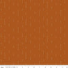 Image of Olive Grove Arrows Terracotta quilting cotton fabric by Amber Elliot for Riley Blake Designs. Features arrows on an orange background. Cute Little Fabric Shop