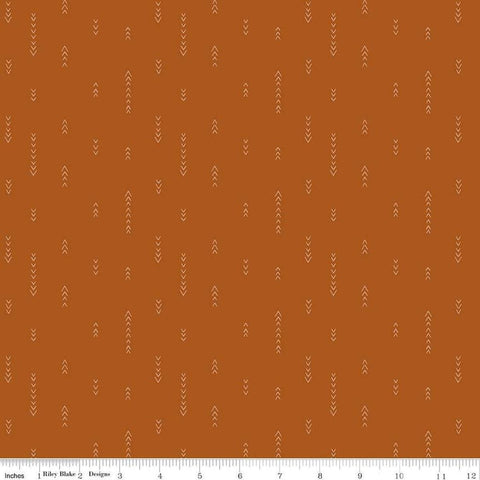 Image of Olive Grove Arrows Terracotta quilting cotton fabric by Amber Elliot for Riley Blake Designs. Features arrows on an orange background. Cute Little Fabric Shop