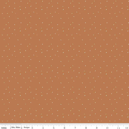 Image of Olive Grove Dots Terracotta quilting cotton fabric by Amber Elliot for Riley Blake Designs. Features dots on an orange background. Cute Little Fabric Shop