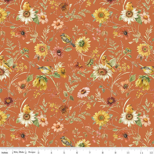 Image of Sunflower Whispers Prairie Pumpkin quilting cotton fabric by Lisa Audit for Riley Blake Designs. Features flowers on an orange background. Cute Little Fabric Shop