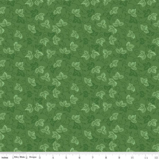 Image of Vera's Garden Leaves Green quilting cotton fabric by Vicki McCarty for Riley Blake Designs. Features leaves on a green background. Cute Little Fabric Shop