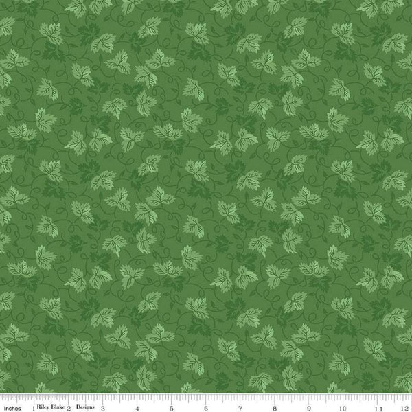 Image of Vera&#39;s Garden Leaves Green quilting cotton fabric by Vicki McCarty for Riley Blake Designs. Features leaves on a green background. Cute Little Fabric Shop
