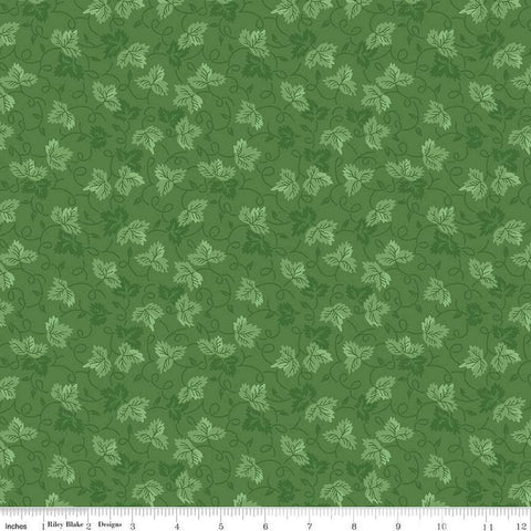Image of Vera&#39;s Garden Leaves Green quilting cotton fabric by Vicki McCarty for Riley Blake Designs. Features leaves on a green background. Cute Little Fabric Shop