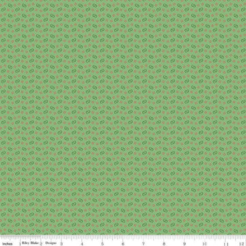 Image of Vera's Garden Circles Green quilting cotton fabric by Vicki McCarty for Riley Blake Designs. Features shapes on a green background. Cute Little Fabric Shop