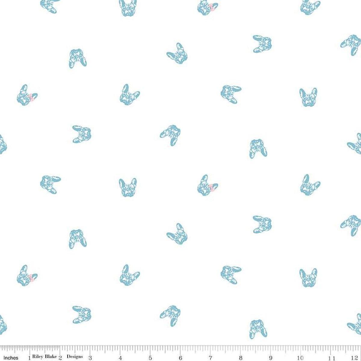 Image of Hush Hush 5 Frenchie Friends quilting cotton fabric by Assorted Designers for Riley Blake Designs. Features dog faces on an off-white background. Cute Little Fabric Shop.
