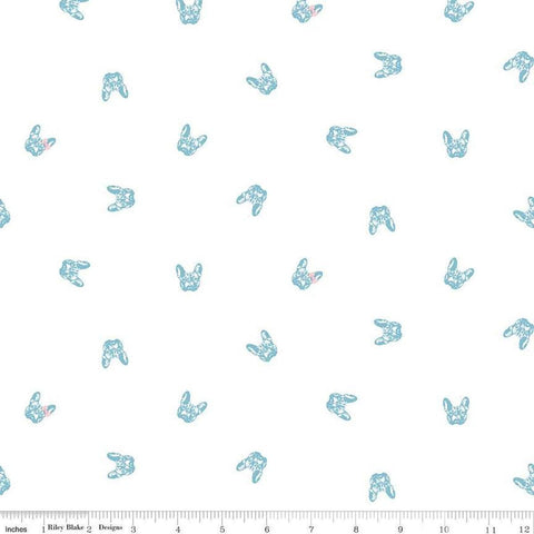 Image of Hush Hush 5 Frenchie Friends quilting cotton fabric by Assorted Designers for Riley Blake Designs. Features dog faces on an off-white background. Cute Little Fabric Shop.