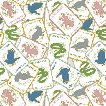 Image of Harry Potter Mystical Winter Wonder Mystical Houses Multi by Warner Brothers Official Licensing for Camelot Fabrics. Features Hogwarts houses on an off-white background. Cute Little Fabric Shop