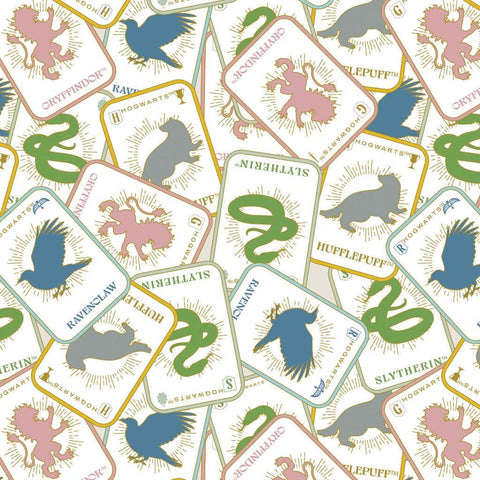 Image of Harry Potter Mystical Winter Wonder Mystical Houses Multi by Warner Brothers Official Licensing for Camelot Fabrics. Features Hogwarts houses on an off-white background. Cute Little Fabric Shop