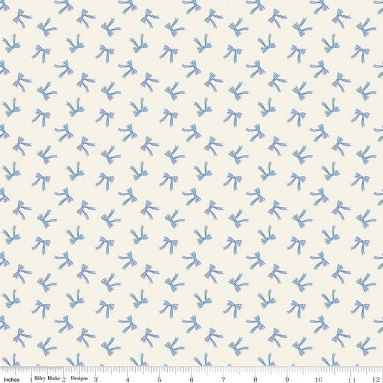 Image of Penelope Bows Cream quilting cotton fabric by My Mind's Eye for Riley Blake Designs. Features bows on a blue background. Cute Little Fabric Shop