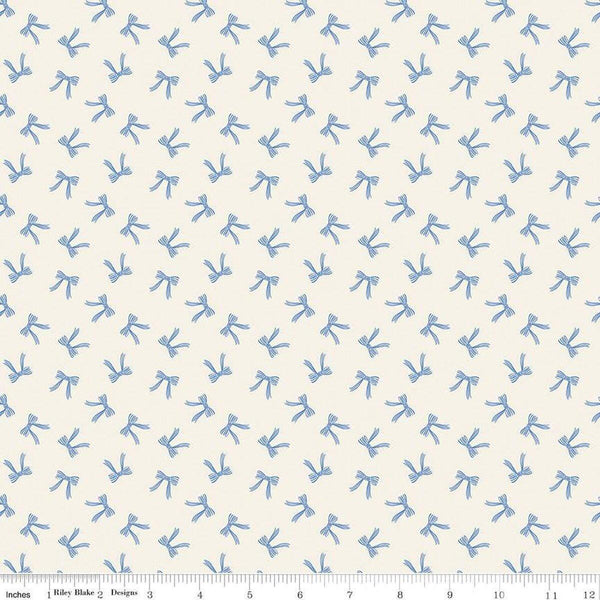 Image of Penelope Bows Cream quilting cotton fabric by My Mind&#39;s Eye for Riley Blake Designs. Features bows on a blue background. Cute Little Fabric Shop
