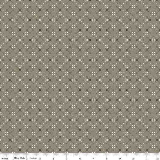 Image of the Evening on the Prairie Geo Floral Green quilting cotton fabric by Modern Prairie for Riley Blake Designs. Features geometric designs on a green background. Cute Little Fabric Shop
