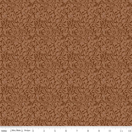 Image of Let's Wander Leaflets Rust quilting cotton fabric by Casey Cometti for Riley Blake Designs. Features leaves on a brown background. Cute Little Fabric Shop