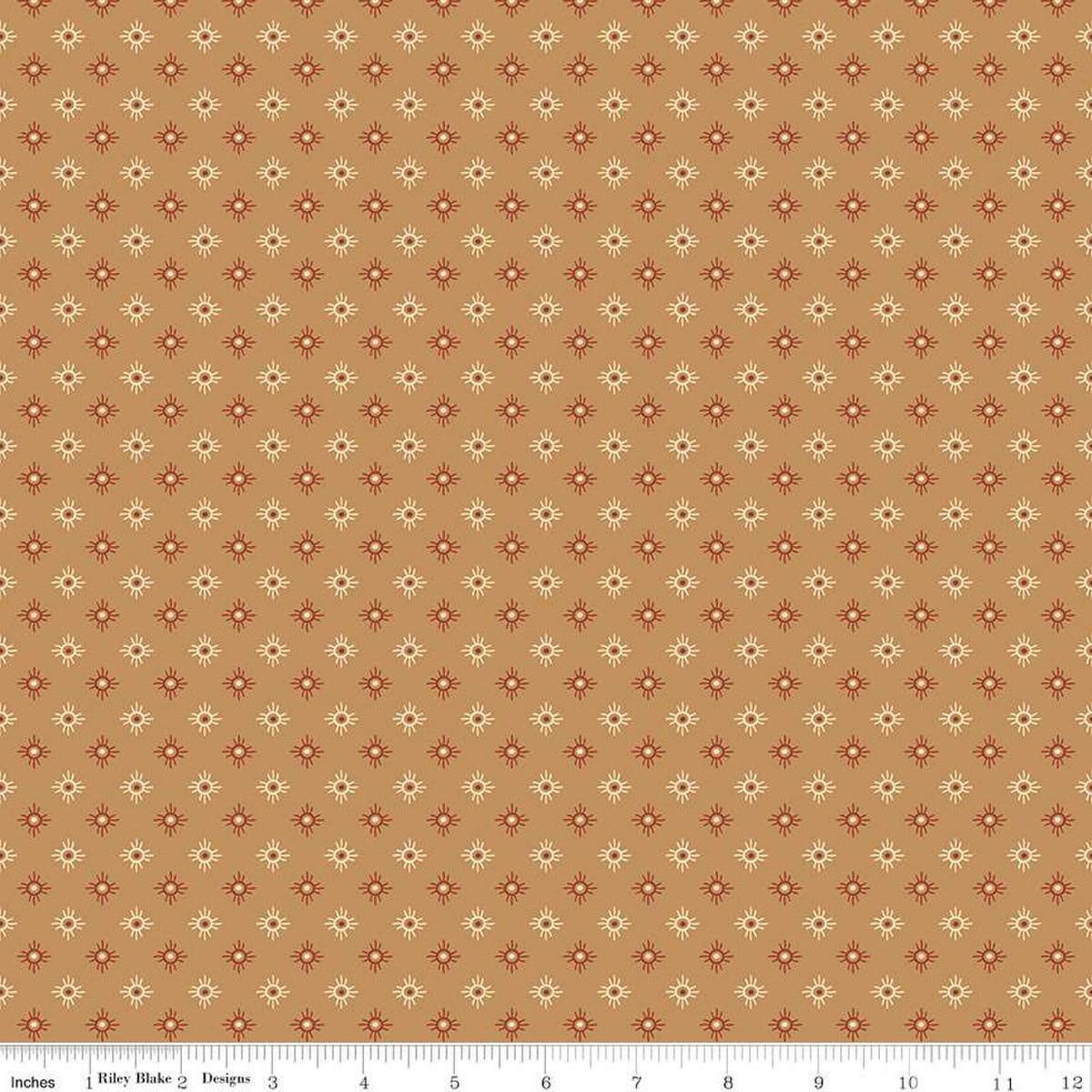 Image of John Wayne American West Sun Tan quilting cotton fabric by Riley Blake Official Product for Riley Blake Designs. Features suns on a tan background. Cute Little Fabric Shop