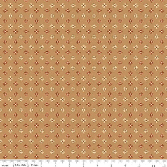 Image of John Wayne American West Sun Tan quilting cotton fabric by Riley Blake Official Product for Riley Blake Designs. Features suns on a tan background. Cute Little Fabric Shop