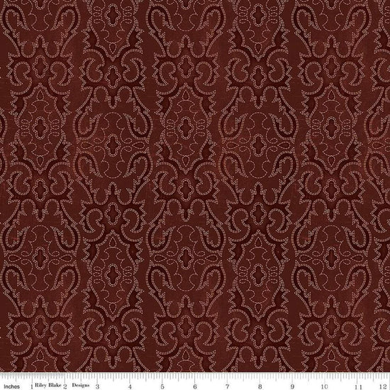 Image of John Wayne American West Boot Stitching Marsala quilting cotton fabric by Riley Blake Official Product for Riley Blake Designs. Features printed embroidery on a red background. Cute Little Fabric Shop