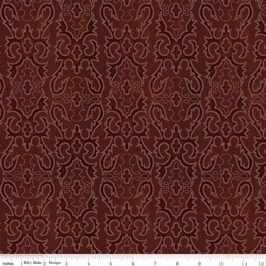 Image of John Wayne American West Boot Stitching Marsala quilting cotton fabric by Riley Blake Official Product for Riley Blake Designs. Features printed embroidery on a red background. Cute Little Fabric Shop
