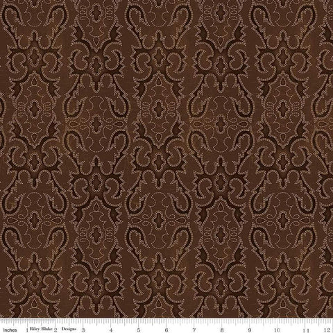 Image of John Wayne American West Boot Stitching Brown quilting cotton fabric by Riley Blake Official Product for Riley Blake Designs. Features printed embroidery on a brown background. Cute Little Fabric Shop