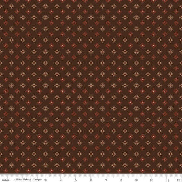 Image of John Wayne American West Sun Brown quilting cotton fabric by Riley Blake Official Product for Riley Blake Designs. Features suns on a brown background. Cute Little Fabric Shop