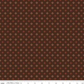Image of John Wayne American West Sun Brown quilting cotton fabric by Riley Blake Official Product for Riley Blake Designs. Features suns on a brown background. Cute Little Fabric Shop