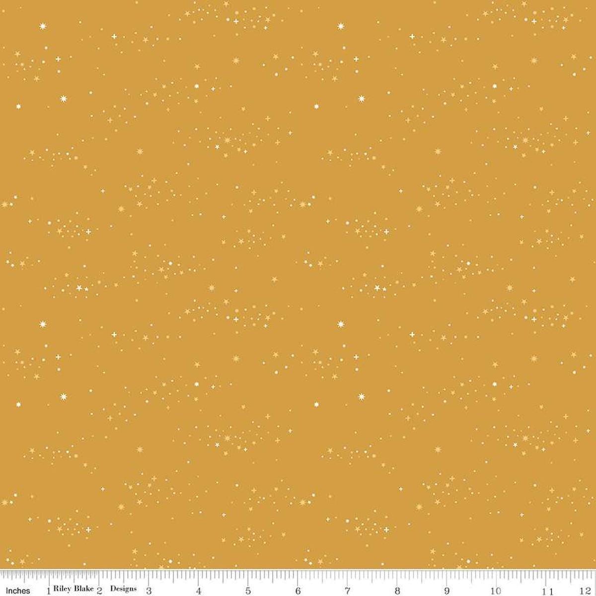 Image of Essence Starlight Golden quilting cotton fabric by Fran Gulick for Riley Blake Designs. Features stars on a yellow background. Cute Little Fabric Shop