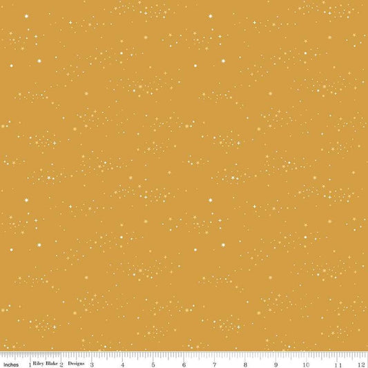 Image of Essence Starlight Golden quilting cotton fabric by Fran Gulick for Riley Blake Designs. Features stars on a yellow background. Cute Little Fabric Shop