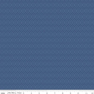 Image of Essence Lattice Denim quilting cotton fabric by Fran Gulick for Riley Blake Designs. Features hexagons on a blue background. Cute Little Fabric Shop