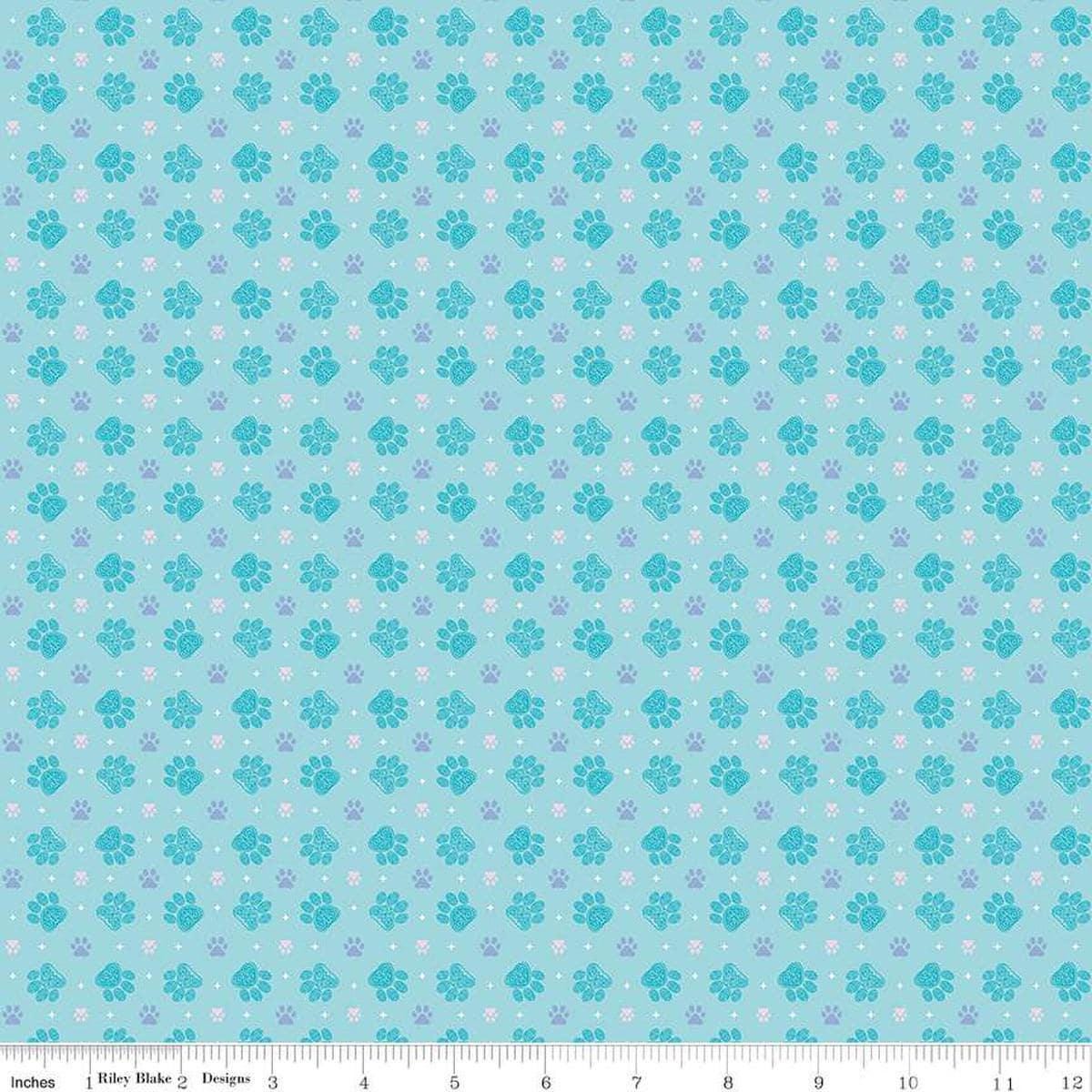 Image of Celtic Cats Paws Aqua quilting cotton fabric by Brigid Ashwood for Riley Blake Designs. Features pawprints on a blue background. Cute Little Fabric Shop
