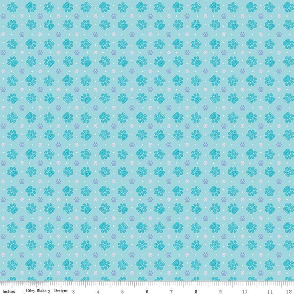 Image of Celtic Cats Paws Aqua quilting cotton fabric by Brigid Ashwood for Riley Blake Designs. Features pawprints on a blue background. Cute Little Fabric Shop