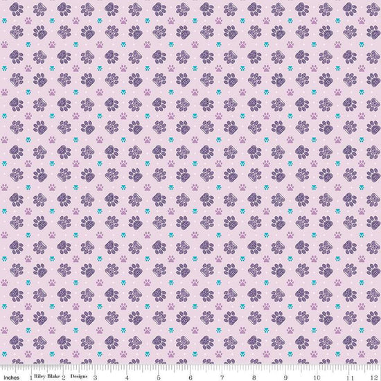 Image of Celtic Cats Paws Lilac quilting cotton fabric by Brigid Ashwood for Riley Blake Designs. Features pawprints on a purple background. Cute Little Fabric Shop