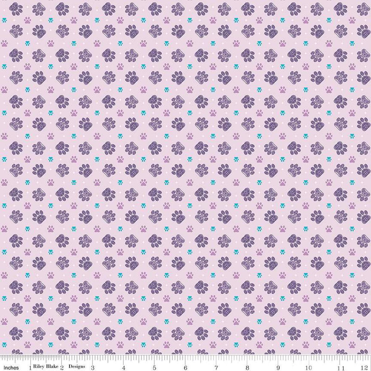 Image of Celtic Cats Paws Lilac quilting cotton fabric by Brigid Ashwood for Riley Blake Designs. Features pawprints on a purple background. Cute Little Fabric Shop